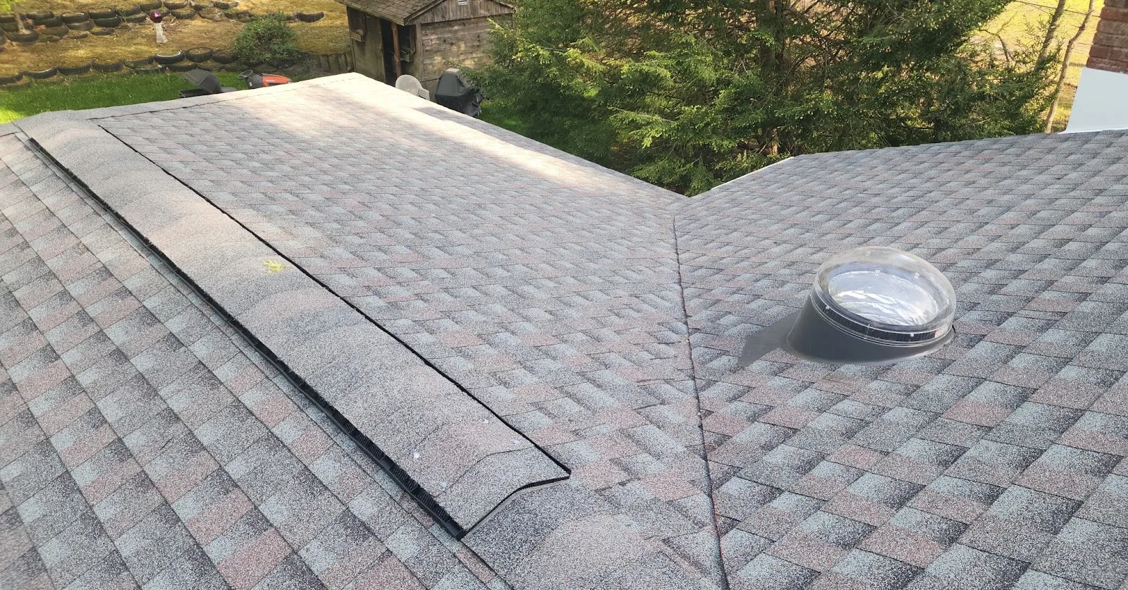 Shingle roof with tubular skylight in Rumson, NJ